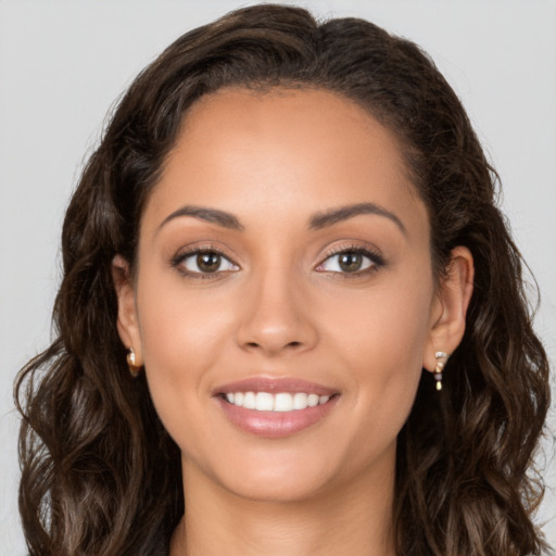 Joyful white young-adult female with long  brown hair and brown eyes