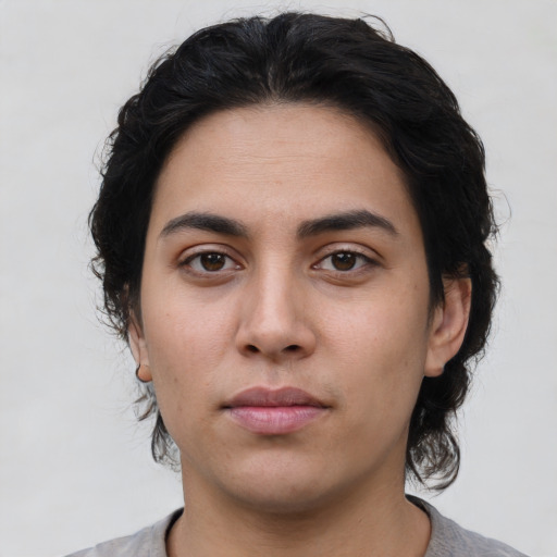 Neutral latino young-adult female with medium  brown hair and brown eyes
