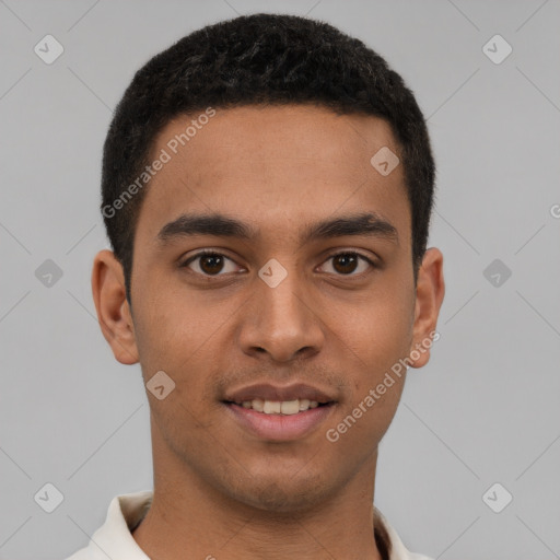 Joyful latino young-adult male with short  brown hair and brown eyes