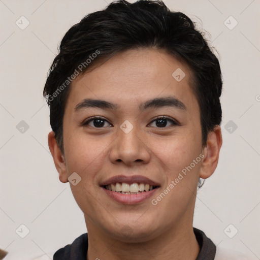 Joyful asian young-adult male with short  brown hair and brown eyes