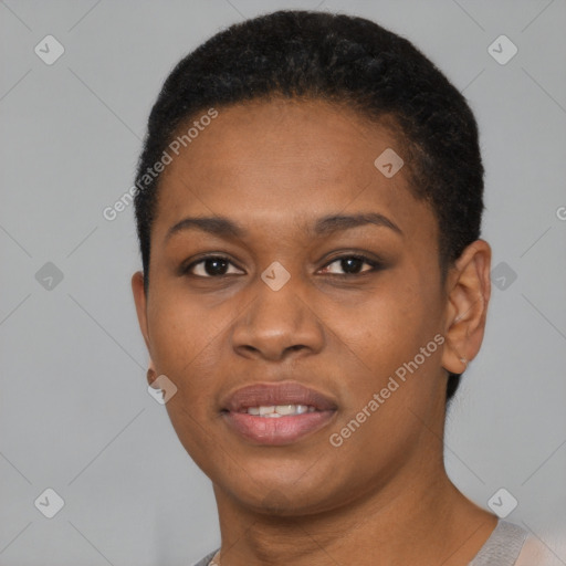 Joyful black young-adult female with short  black hair and brown eyes