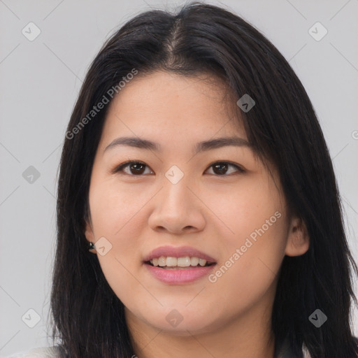 Joyful asian young-adult female with long  brown hair and brown eyes