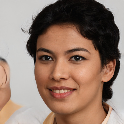 Joyful asian young-adult female with medium  brown hair and brown eyes