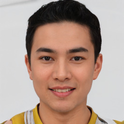 Joyful asian young-adult male with short  brown hair and brown eyes