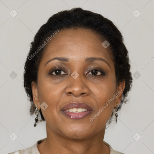 Joyful black adult female with short  brown hair and brown eyes