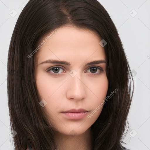 Neutral white young-adult female with long  brown hair and brown eyes