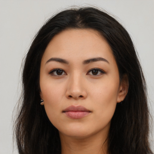 Neutral latino young-adult female with long  brown hair and brown eyes
