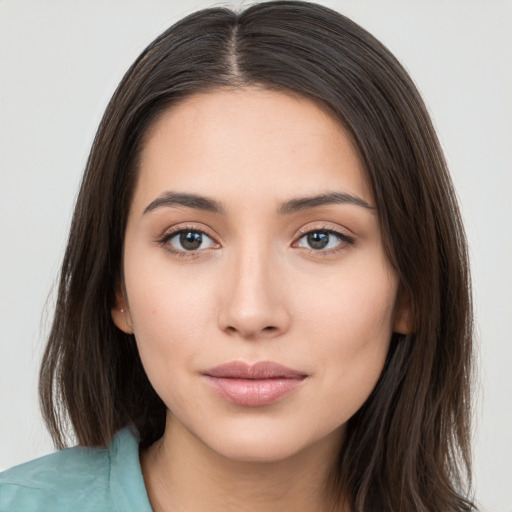 Neutral white young-adult female with long  brown hair and brown eyes