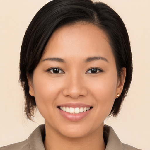 Joyful white young-adult female with medium  brown hair and brown eyes