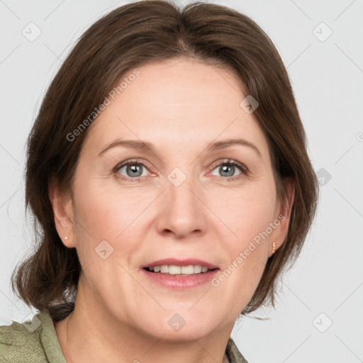 Joyful white adult female with medium  brown hair and grey eyes