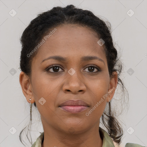 Joyful black young-adult female with medium  brown hair and brown eyes