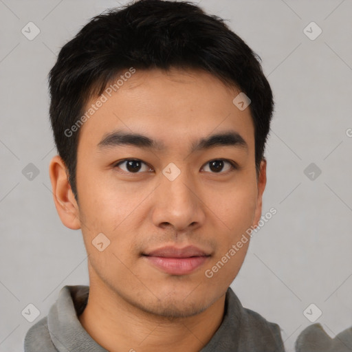 Joyful asian young-adult male with short  black hair and brown eyes