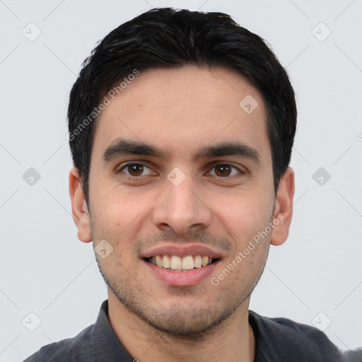 Joyful white young-adult male with short  black hair and brown eyes