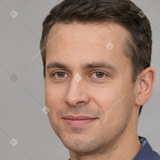 Joyful white adult male with short  brown hair and brown eyes