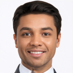 Joyful white young-adult male with short  black hair and brown eyes