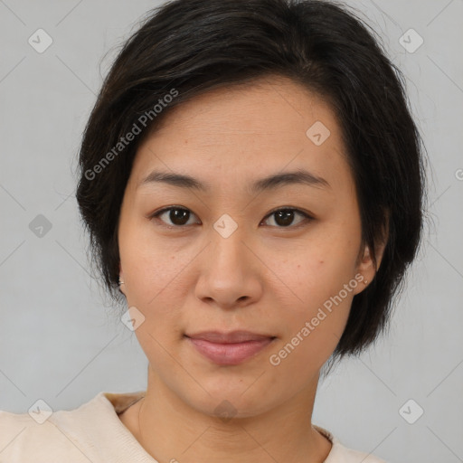 Joyful asian young-adult female with medium  brown hair and brown eyes