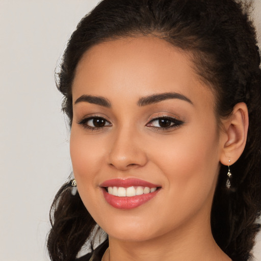 Joyful white young-adult female with long  brown hair and brown eyes