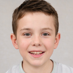 Joyful white child male with short  brown hair and brown eyes