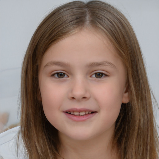 Joyful white child female with long  brown hair and brown eyes