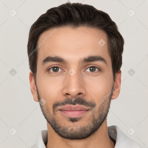 Joyful white young-adult male with short  black hair and brown eyes