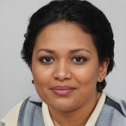 Joyful black young-adult female with medium  brown hair and brown eyes