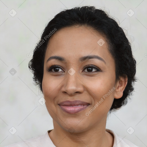 Joyful latino adult female with short  brown hair and brown eyes