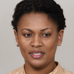 Joyful latino adult female with short  brown hair and brown eyes