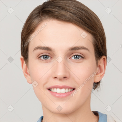 Joyful white young-adult female with short  brown hair and grey eyes