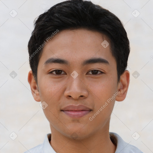 Joyful asian young-adult male with short  brown hair and brown eyes