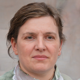 Joyful white adult female with short  brown hair and grey eyes