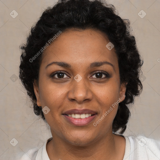 Joyful black adult female with short  brown hair and brown eyes