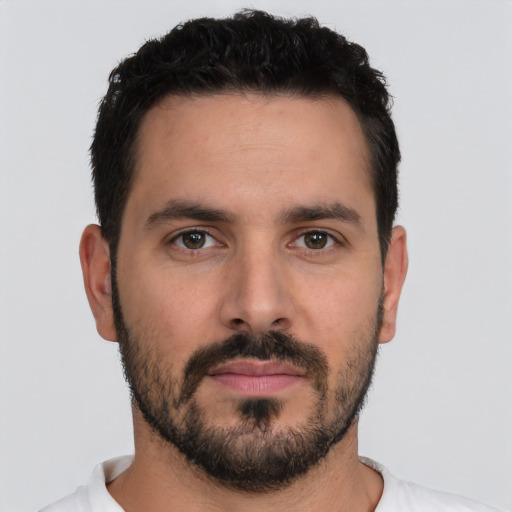 Neutral white young-adult male with short  black hair and brown eyes