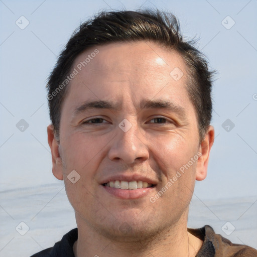 Joyful white adult male with short  brown hair and brown eyes