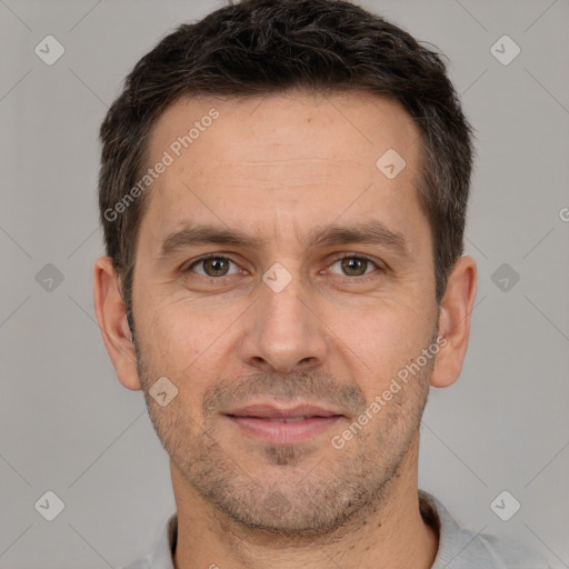 Joyful white adult male with short  brown hair and brown eyes