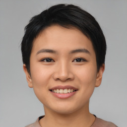 Joyful asian young-adult female with short  black hair and brown eyes