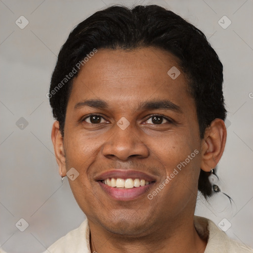 Joyful black young-adult male with short  brown hair and brown eyes