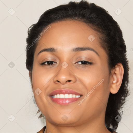 Joyful latino young-adult female with medium  brown hair and brown eyes