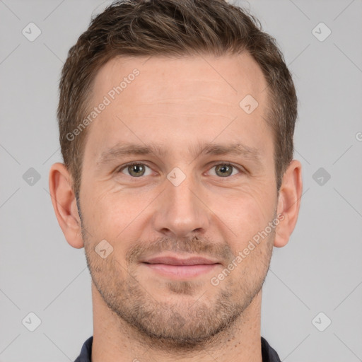 Joyful white adult male with short  brown hair and brown eyes