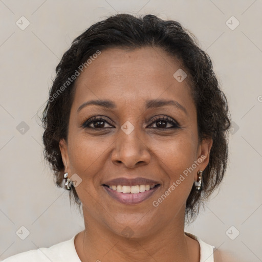 Joyful black adult female with medium  brown hair and brown eyes