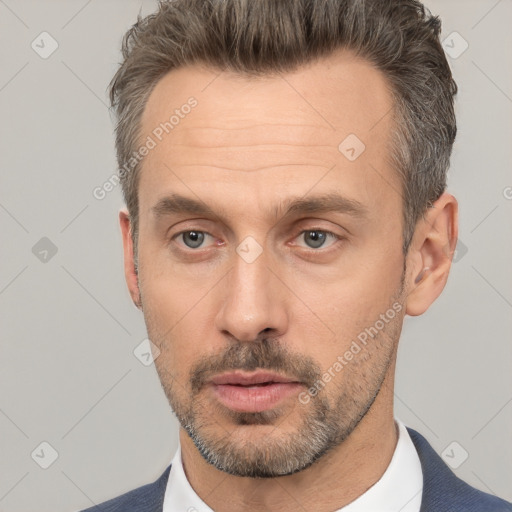 Neutral white adult male with short  brown hair and brown eyes