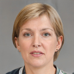 Joyful white adult female with short  brown hair and grey eyes