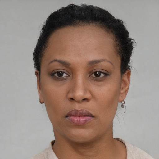 Neutral black adult female with short  brown hair and brown eyes