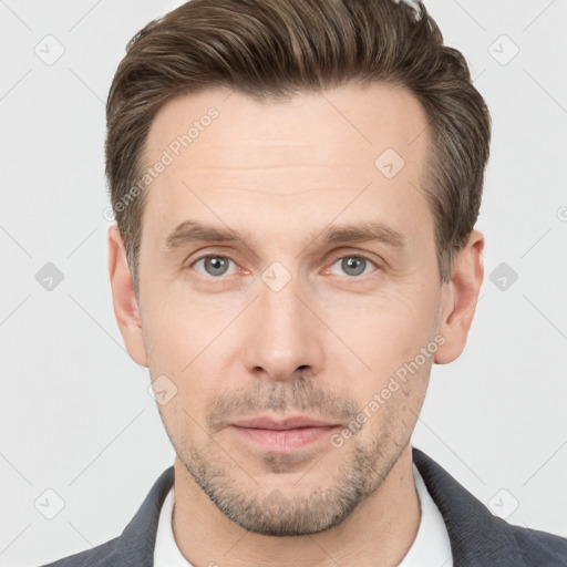 Neutral white adult male with short  brown hair and grey eyes