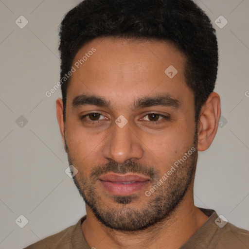 Joyful white young-adult male with short  black hair and brown eyes