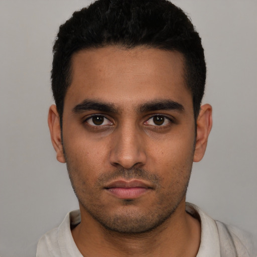 Neutral latino young-adult male with short  black hair and brown eyes