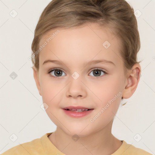 Joyful white child female with short  brown hair and brown eyes