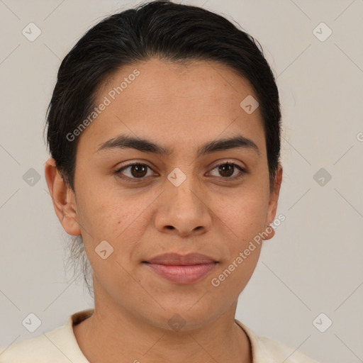 Joyful latino young-adult female with short  brown hair and brown eyes