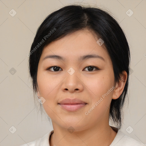 Joyful asian young-adult female with medium  black hair and brown eyes