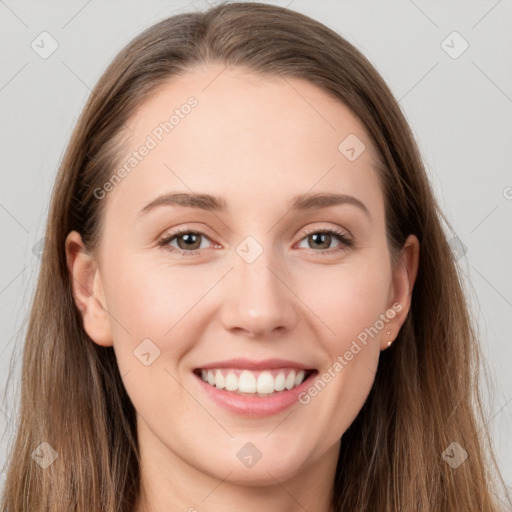 Joyful white young-adult female with long  brown hair and grey eyes