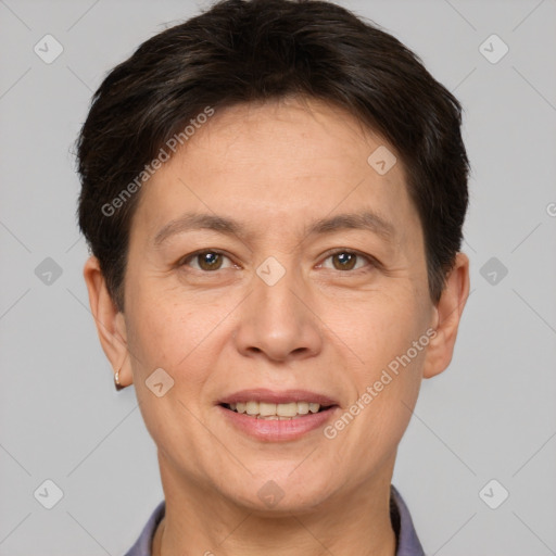 Joyful white adult female with short  brown hair and brown eyes